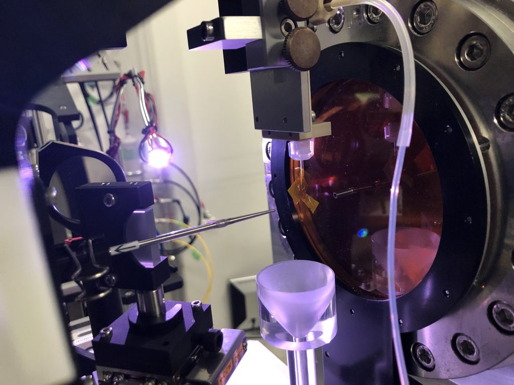 This shows the experimental apparatus before the measurement. The orange yellow tape hanging off the clear injector pipe in the middle of the image marks the spot where the X-rays will meet the sample.