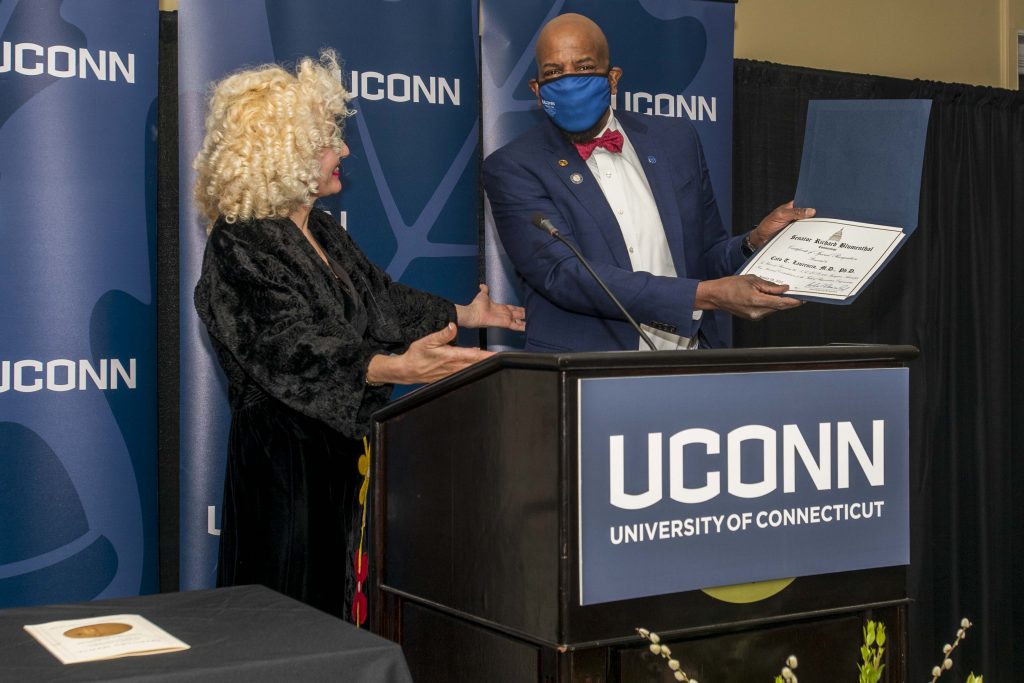 Incoming Interim UConn President Radenka Maric presents Dr. Cato Laurencin with a certificate from the US Senate congratulating him on receiving the Spingarn Medal.