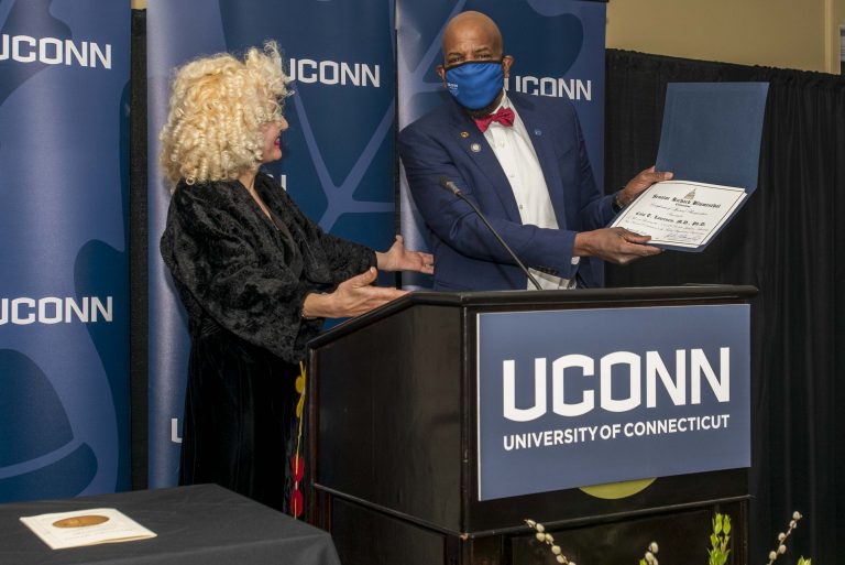Incoming Interim UConn President Radenka Maric presents Dr. Cato Laurencin with a certificate from the US Senate congratulating him on receiving the Spingarn Medal.