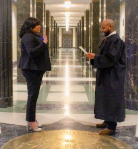 Alumna Natalie Braswell is sworn in as Connecticut's first Black comptroller by State Supreme Court Justice Raheem Mullins (courtesy of Natalie Braswell). 