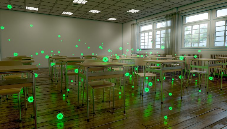 A school classroom with empty desks, and illustrations of the coronavirus.