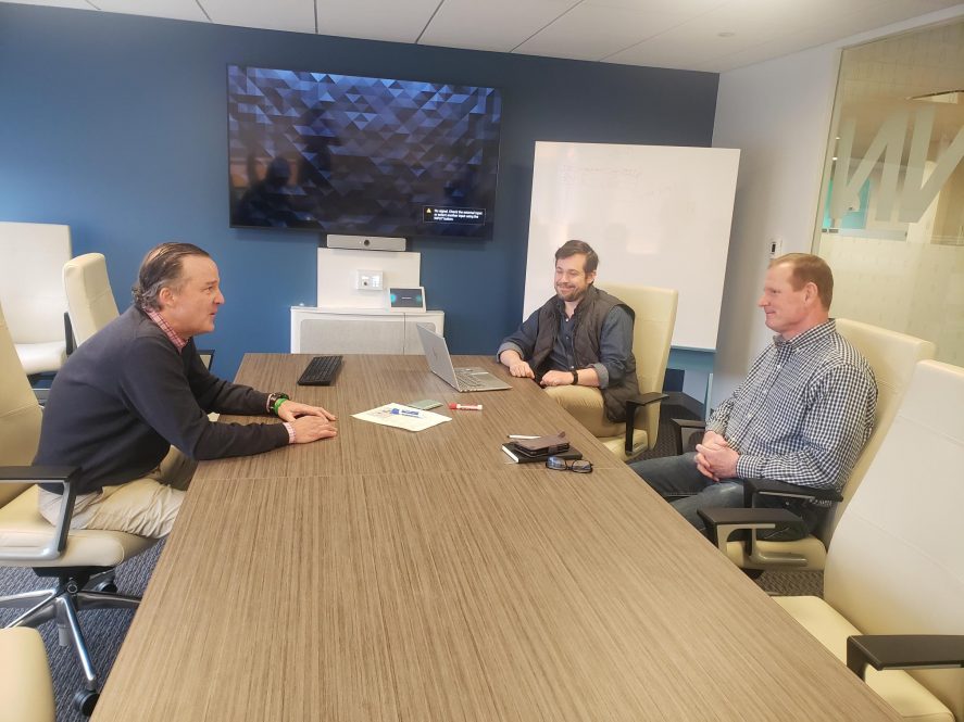 Entrepreneur-in-Residence Alexsandr Tropps (center) meets with executives of TIP Digital startup ConnexMarkets (CXM): Jeff Hudson, chief marketing officer (left), and Tim Clorite, chief executive officer (right). (Contributed photo)