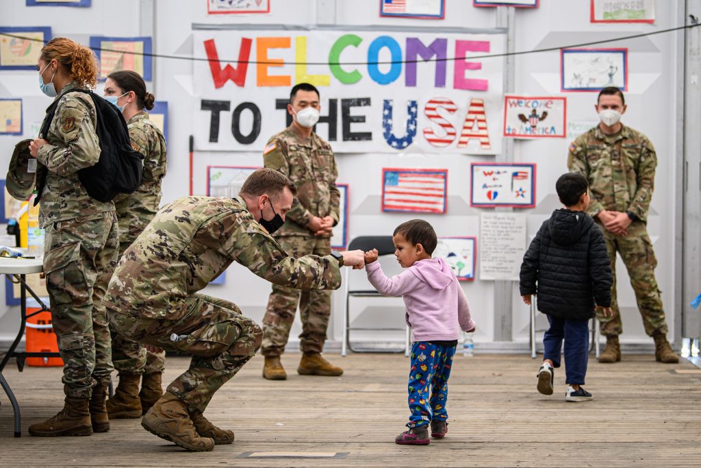 Evacuees from Afghanistan wait for boarding into a passenger plane bound for the U.S. at the U.S. military's Ramstein air base on October 09, 2021 in Ramstein, Germany. (Photo by Lukas Schulze/Getty Images)