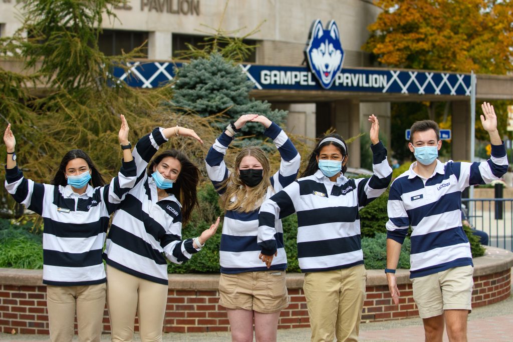 UConn Tour Guides Kavya Ganugapati '22 (CAHNR), Allison Zweig '22 (BUS), Alexandra Stamboulis '22 (BUS), Sam Dorman '22 (CLAS)(BUS), and Sofia Rodriguez '22 (CLAS)show their UConn spirit during an Open House visit on Oct. 16, 2021. (Kayla Simon/UConn Photo)