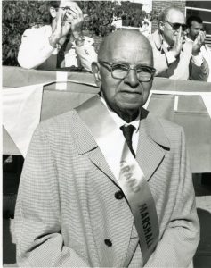 Alan Thacker Busby in 1990, serving as grand marshal for the UConn Homecoming Parade.