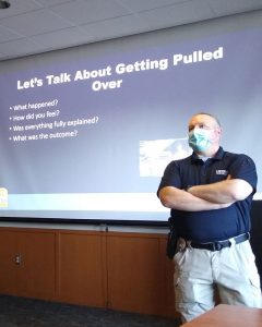 Officer O'Reilly instructing in front of projector screen