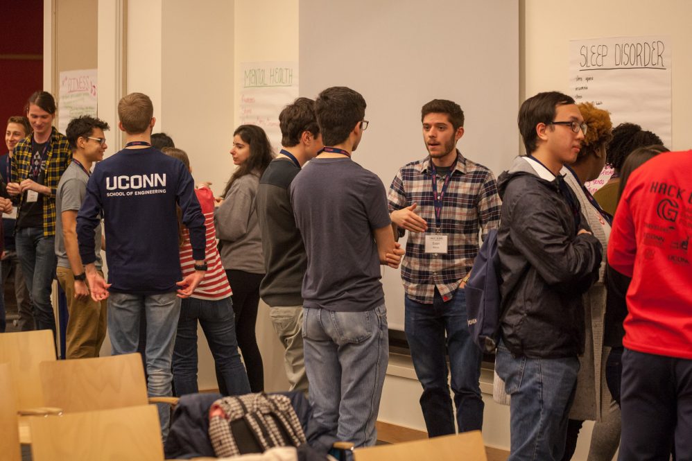 Students brainstorming at the last HackUConn held in person, in 2019.