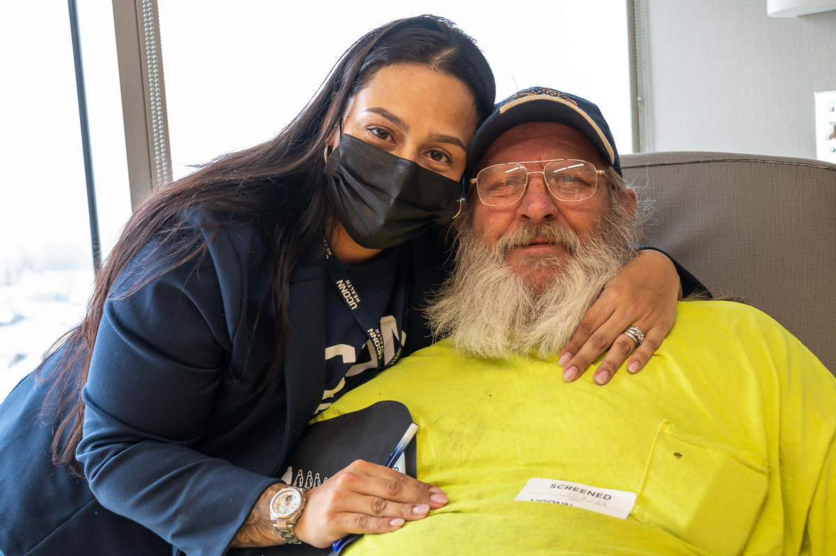 Jasmine Ortiz-Rivas with patient in hospital room