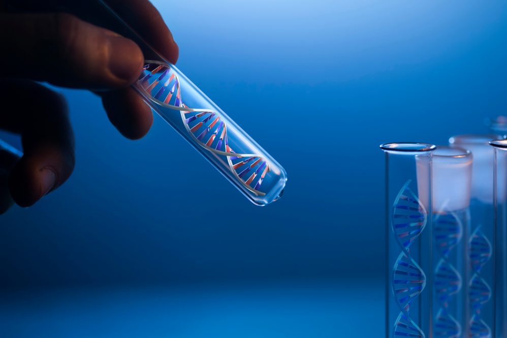 DNA molecule in glass tube in hand of scientist on blue background.