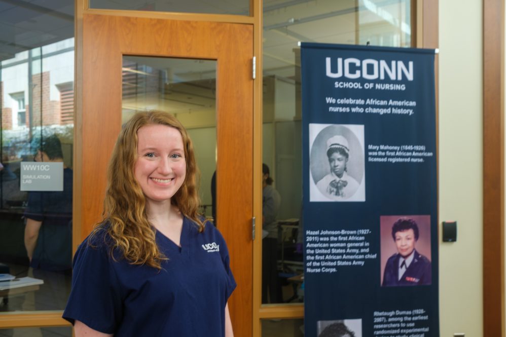 Kelsey MarcAurele, outside the simulation lab at the Widmer wing of Storrs Hall