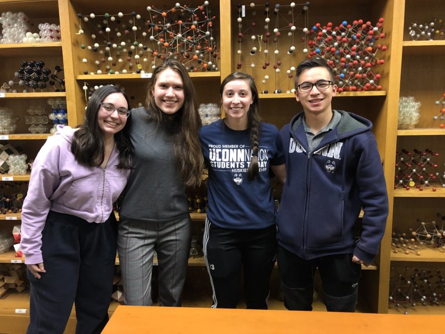 Soon-to-be UConn graduates, from left, Catherine Odendahl '22 (ENG) of Trumbull, Viktoria Sinani '22 (CLAS) of Branford, Marissa Airoldi '22 (CLAS) of Tolland, and Caleb Blanchard '22 (CLAS) of Mansfield pose for a photo recently. They helped run the Southern New England Middle School Science Bowl in February.
