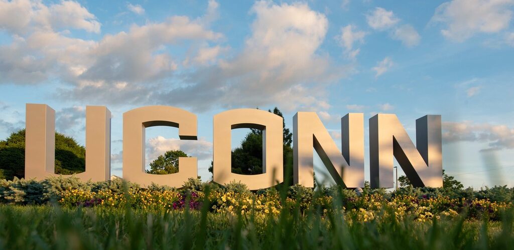 The UConn large letter sign at dusk on June 12, 2021. (Sean Flynn/UConn Photo)