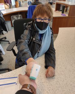 Carol Stabley taking temperature via wrist
