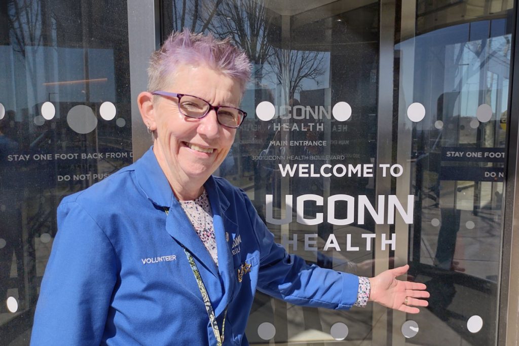 Joan Munroe portait outside UConn Health front entrance