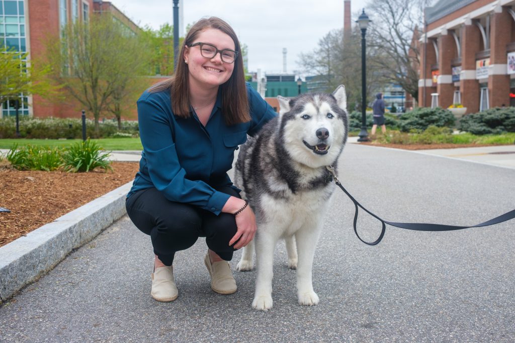 Zoey England, a Gilman-McCain scholar, pets Jonathan XIV on May 3, 2022.