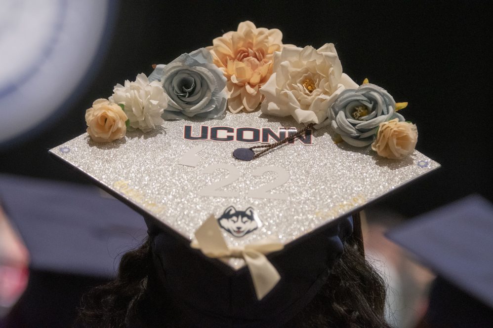 Close up of a UConn-decorated mortarboard