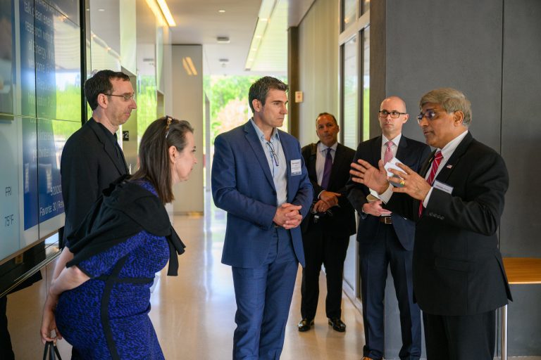 Sethuraman Panchanathan, right, director of the National Science Foundation, speaks with Ofer Harel, left, associate dean and professor of statistics, Anne D'Alleva, interim provost, and Emmanouil Anagnostou, interim executive director, during a tour of the Innovation Partnership Building