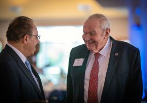 Karl Nieforth speaks with Mohamed Mohamed at the 2019 School of Pharmacy alumni reunion. 