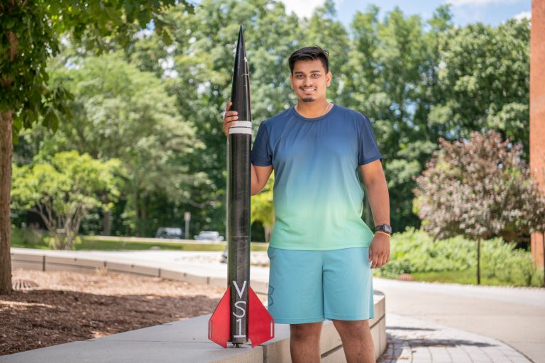 UConn rising senior Hritish Bhargava poses with his VS1 rocket.