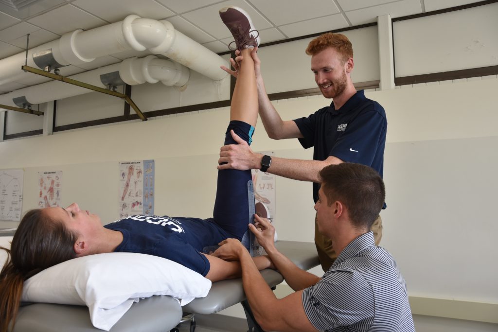 Students stretching in lab