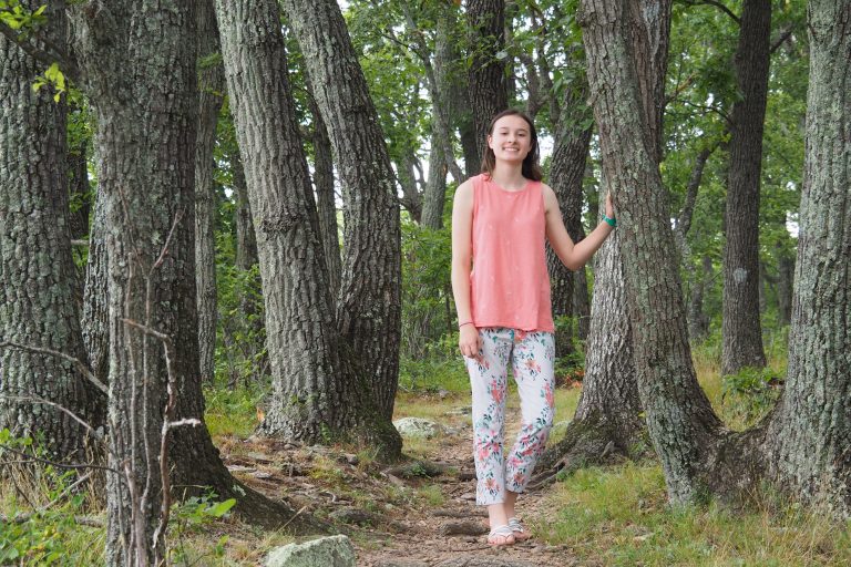 Smiling woman in woods