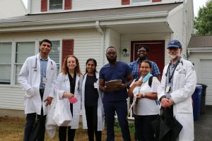 UConn Health volunteer students with Hartford residents, who received doses of the COVID-19 vaccine at their homes.