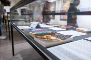 A section of books on display in the “Ray Guns, Dames, and the Guilty Gaze: Feminism and the Golden Age of Science Fiction Pulps” exhibition on display in the William Benton Museum of Art 