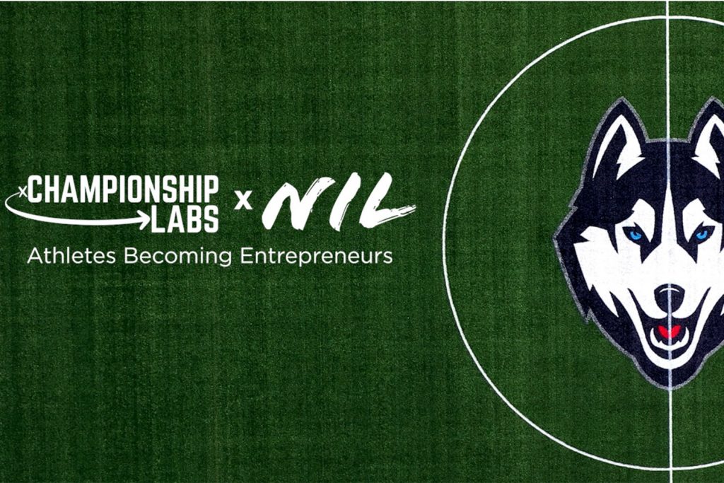 Championship lab and NIL logo on the UConn soccer field