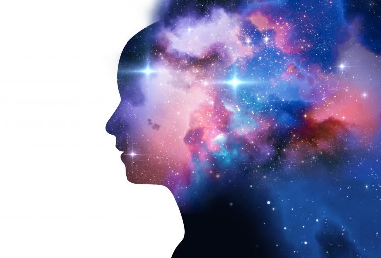 silhouette of virtual human with aura chakras on space nebula , represent meditation,yoga and deep sleep therapy.