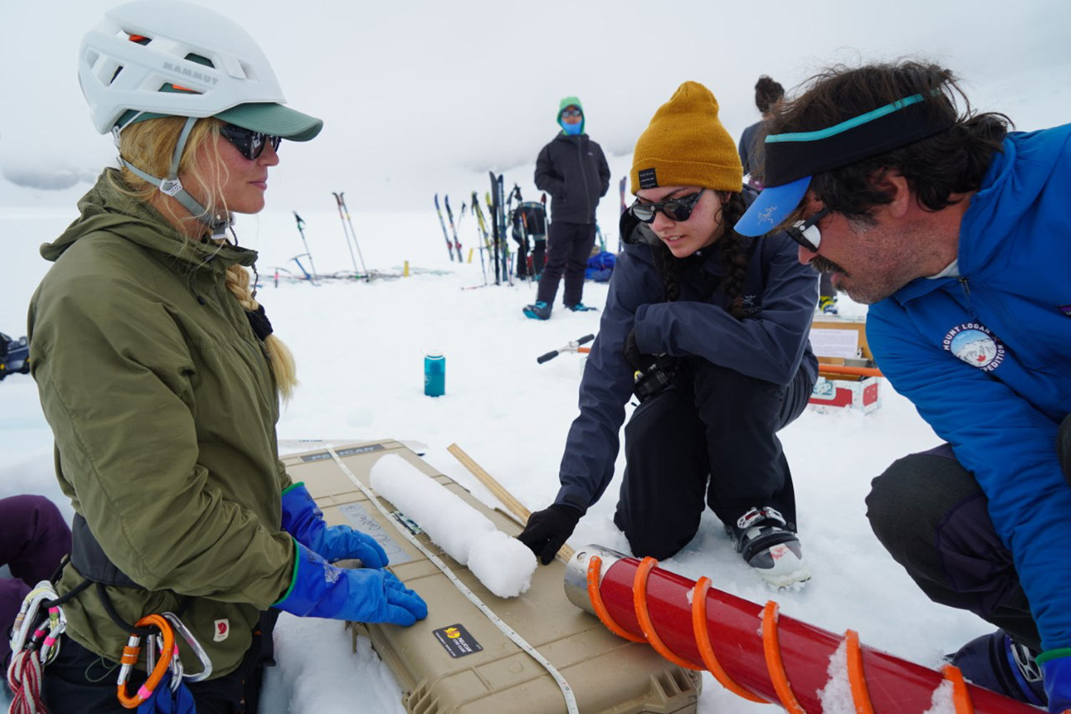 Students use snow coring equipment in Juneau Icefield.