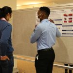 Sandro D. Cloiseau presents his research during the poster session