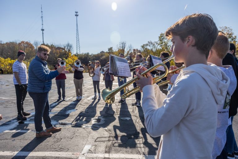 Students from the Stonington High School marching band rehearse with members of the UConn marching band during one of UCMB’s high school band clinics