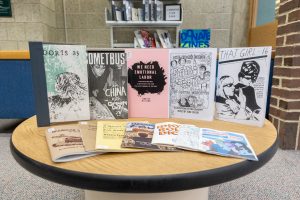 Zines that are available in the Liberated Zine Zone on Level B of the library sit in front of the display on Nov. 17, 2022.