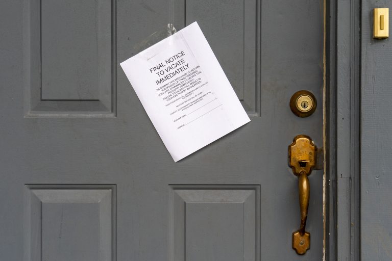 An eviction notice affixed to a front door.