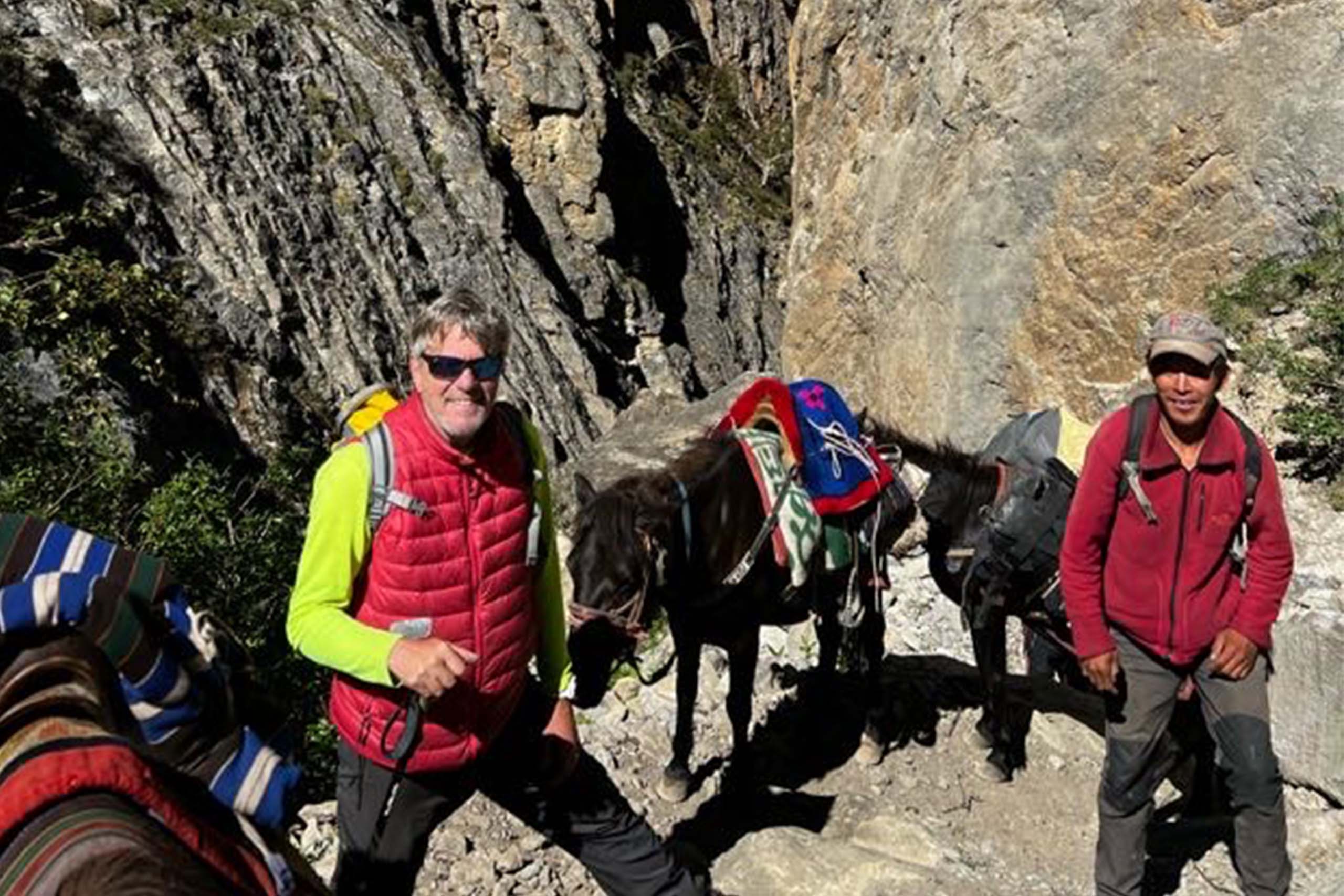 Peter Werth III ’80 (CLAS), with a Nepali guide, during the hike to the yak cheese factory in Bhijer. Werth’s nonprofit organization, Himalaya Currents, works to support community development efforts in Himalayan villages.