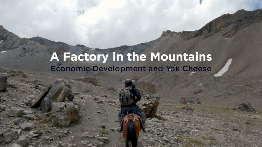 A photo of a student riding a horse in the Himalayan Mountains with the title "A Factory in the Mountains" over top of it