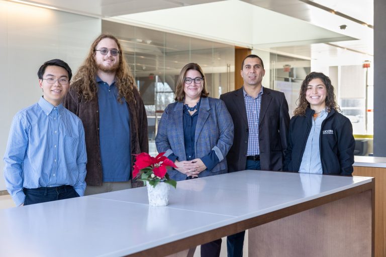 From left, SmartBuildings CT program members Andre Jin, Eric Venables, Amy Thompson, Mohammed Albayati and Julia DeOliveira pose for a photo in the Innovation Partnership Building at UConn Tech Park