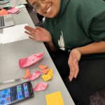 Students write letters to seniors and create origami toys for pediatric dental patients.