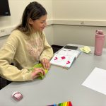 Students write letters to seniors and create origami toys for pediatric dental patients.