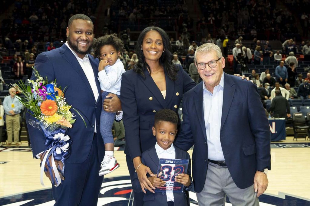 At Gampel Pavilion last fall, Cash — with husband Steve Canal, sons Saint and Syer, and Coach — became the third Husky to have a basketball number retired. “I feel like we helped transition UConn into a different stratosphere,” says Number 32 of her ’02 Husky team.
