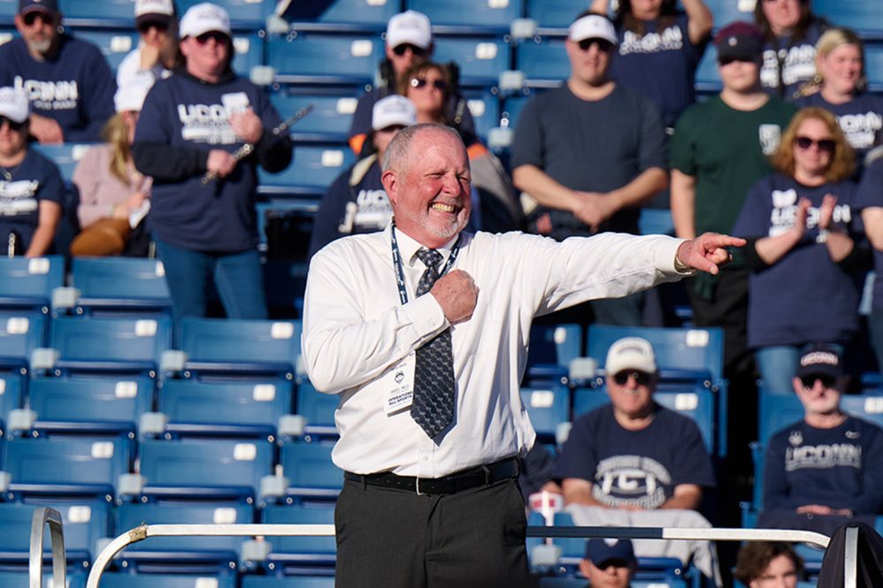 David Mills directing the uconn marching band at rentschler field