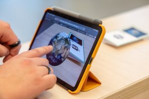 SmartCards AR co-creator Justin Nappi interacts with the product’s current interface on his iPad 