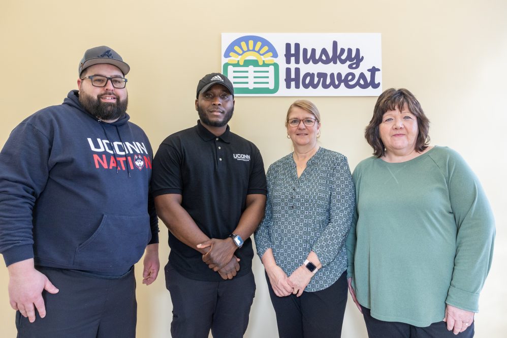 From left, Daniel Malinak, Geraldo White, Heidi Slater and Tracey Roy pose for a photo in the Husky Harvest space near Charter Oak Apartments in Storrs