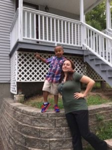 Jessica Parmelle with son, 4, in front of their new home
