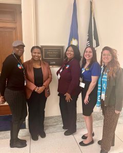 Five women outside a congressional office