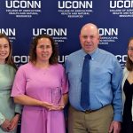 Jennifer ’94 and William Syme ’92, ’97 (center), UConn 4-H Leadership Award recipients. Joined by their daughters and current CAHNR students, Emily (left) and Becca (right) (Jason Sheldon/UConn Photo)