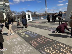 Slogans being chalked outside the United Nations during a recent conference on the status of women.