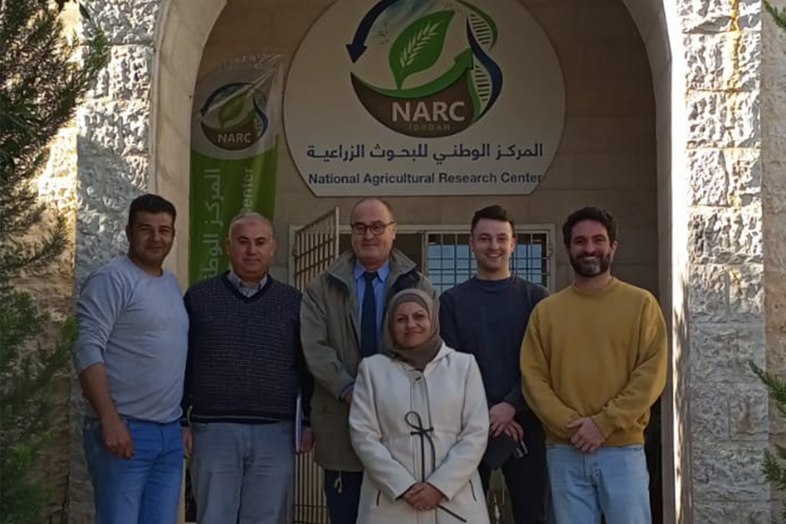 Shlash al-Oun (left), Goggins (center right), and David Coles with researchers at the National Agricultural Research Center in Jordan.