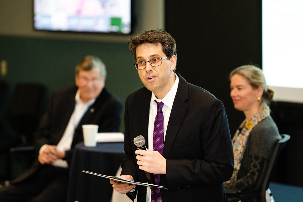 the Global Business Leadership in Sustainability Summit (GBLSS) was held on March 24th, 2023. Professor Robert Bird (center) introduces Dean John A. Elliott (left) and Dinah Koehler, head of ESG Research at FactSet. (Nathan Oldham / UConn School of Business)