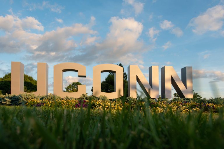 The UConn large letter sign at dusk on June 12, 2021.